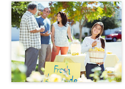 Image of Neighbors next to a lemonade stand.