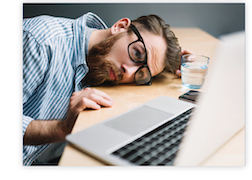 Guy Laying on Desk